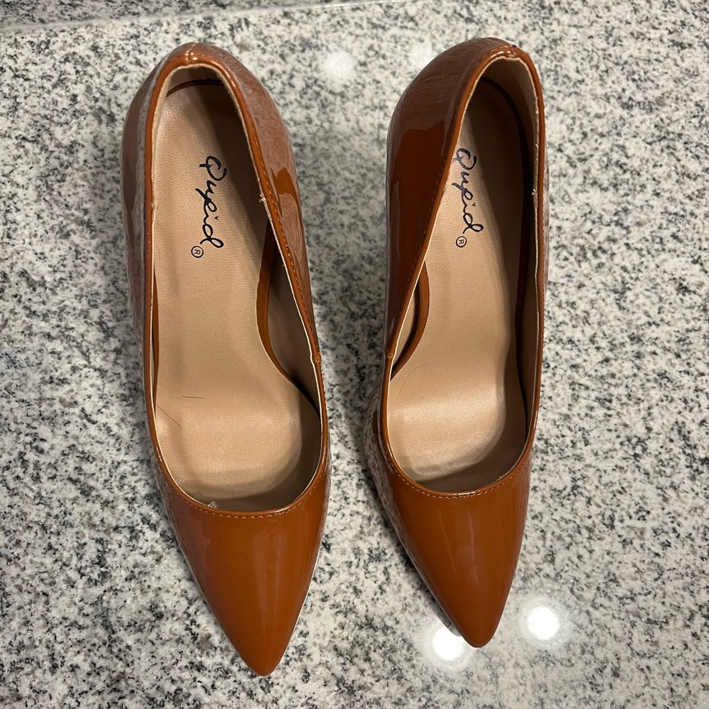 Brown pointed toe pumps